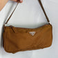 Prada Nylon color cioccolato/senape scuro.
