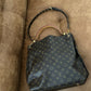 Louis Vuitton Metis hobo.
Monogram