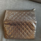 Timeless Chanel Pochette gold rose.