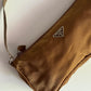 Prada Nylon color cioccolato/senape scuro.